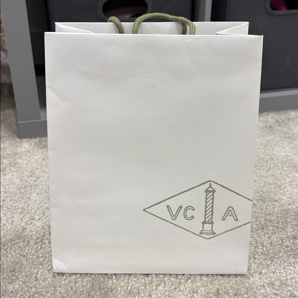 Van Cleef & Arpels White Bag with Green Text